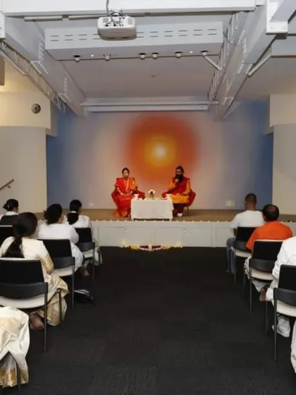 A view from the audience during our Siddha Healing and Meditation program in Sydney. The setup is designed to focus all attention on the spiritual guidance being shared.