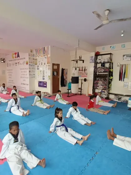 Students work on their core and leg strength with this seated exercise.