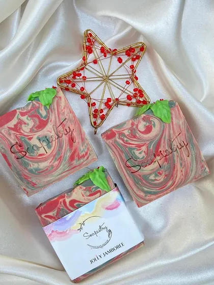 The Jolly Jamboree soap, with its festive red and green swirls and a little soap leaf on top.