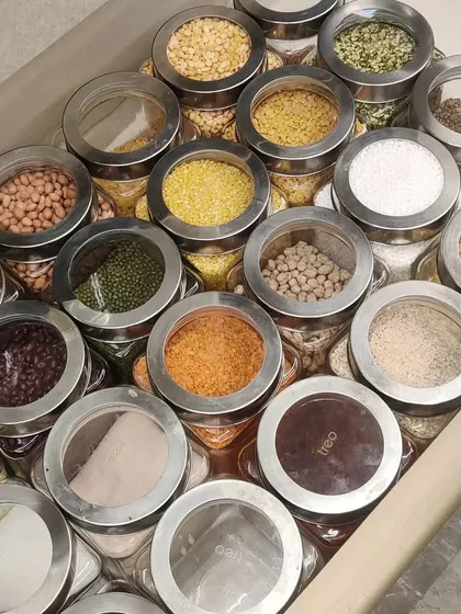 This image showcases the same Tero glass jars from a different angle, highlighting how neatly they fit within a drawer, making it easy to see your entire stock of dry goods.