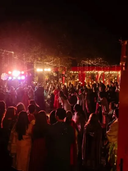 A wide shot of the packed Sangeet party, with vibrant lighting creating an electric atmosphere for a night of non-stop dancing.