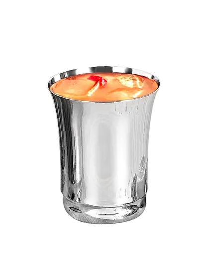 A single steel glass filled with a drink, shot on white to isolate the product and highlight its reflective surface.