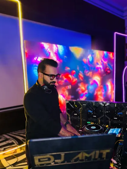 My DJ setup against a colorful abstract LED background. I'm built for everyday energy, not just the weekend.