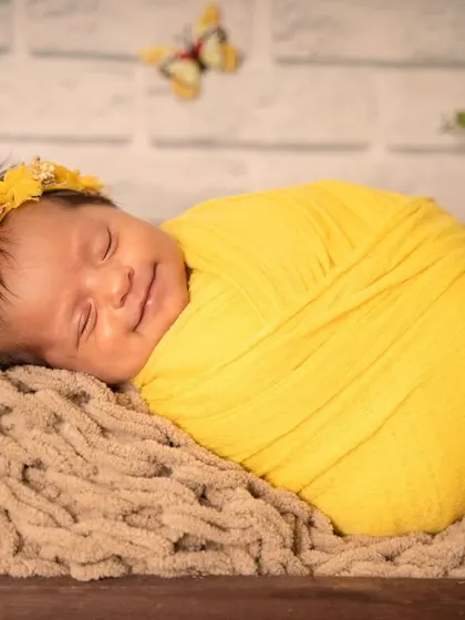 That sleepy newborn smile is pure magic. Capturing these fleeting expressions is one of the most rewarding parts of my job, giving you a memory of their earliest, sweetest dreams.