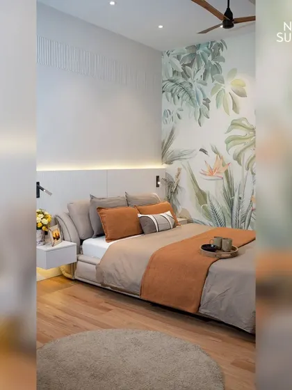 Welcome to an eco-chic master bedroom, where a large botanical feature wall brings nature indoors. The minimalist bed with a floating nightstand and integrated headboard lighting creates a serene, uncluttered vibe.