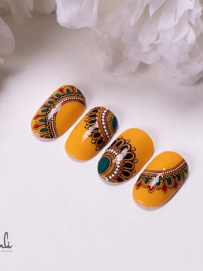 Another angle of the yellow mandala nails, perfect for celebrating Janmashtami with style.