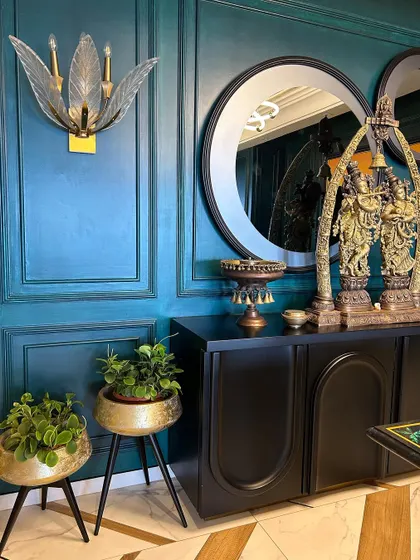 We selected these elegant brass planters with stands to match the client's luxurious interior decor. The choice of Peperomia plants adds a delicate touch of green without overpowering the ornate corner.