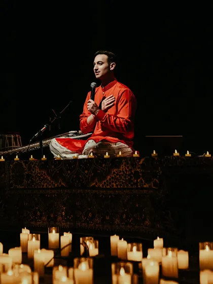 Speaking to the audience in Ahmedabad, surrounded by candlelight. I believe in sharing stories and creating a personal connection, making each concert a shared dialogue.