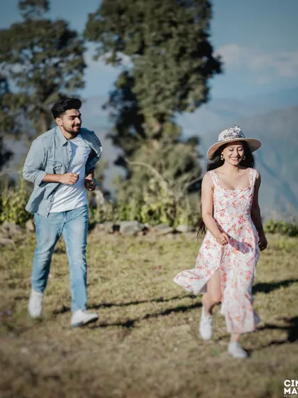 A playful, candid moment of a couple running through a mountain meadow. This captures their fun-loving energy and the freedom of being in nature, a key part of my unscripted photography approach.