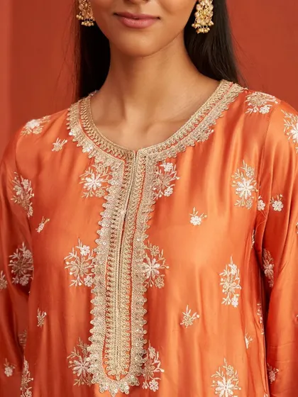 A close up of the beautiful embroidery on the neckline of the Kangna Burnt Orange Kurta Set.