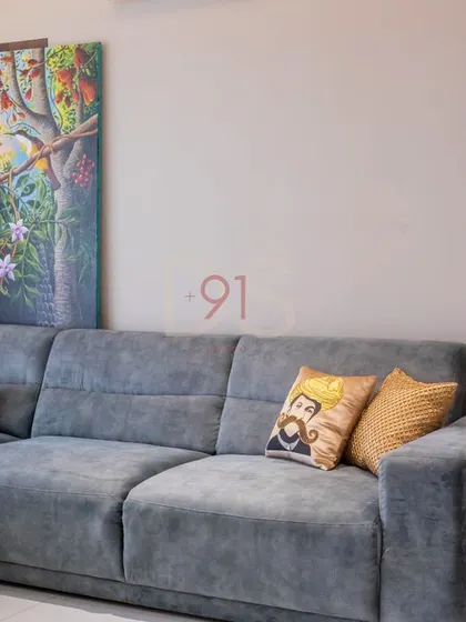 A close-up of the sofa styling, where we mix textures and patterns to create a comfortable and visually interesting corner.