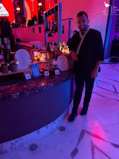 Our founder posing by the Japanese-themed bar. The setup included multiple stations with QR codes for menus, ensuring a seamless and modern experience for guests exploring our sake and cocktails.
