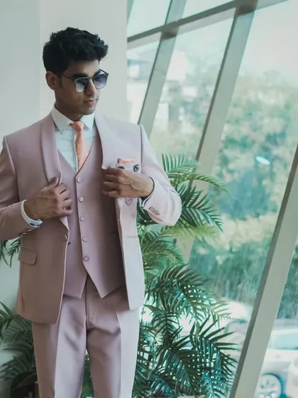 The pastel pink suit looks great from every angle, perfect for photos.