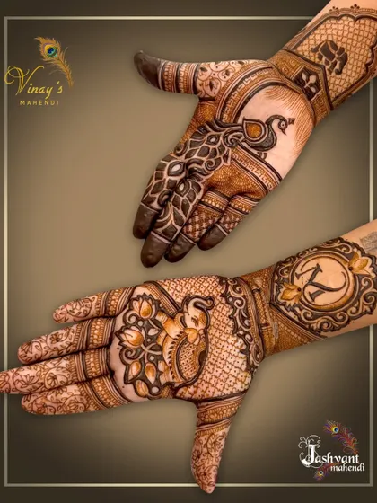 An asymmetrical design featuring a peacock on the back of one hand and an initial 'K' on the other.