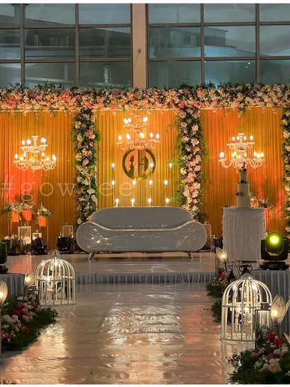 A wider view of the lavish reception stage, showcasing the scale of the decor.
