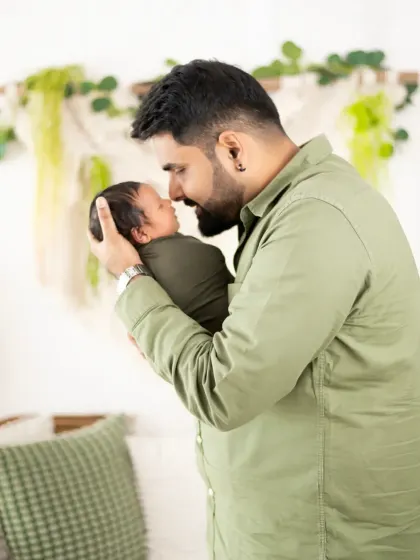 A father's love for his newborn. This close-up shot captures the intimate and powerful bond between a dad and his tiny baby in the first few days of life.