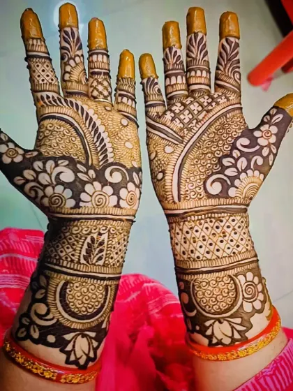 A view of a floral palm design, showing the coverage on the fingers and wrist.