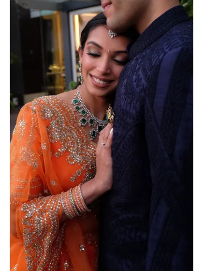 A tender, emotional moment. Her makeup is soft and romantic, enhancing this beautiful memory.