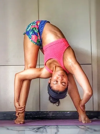 "The bamboo that bends is stronger than the oak that resists." This Revolved Standing Forward Bend (Parivrtta Uttanasana) embodies that philosophy, teaching us to go with the flow.