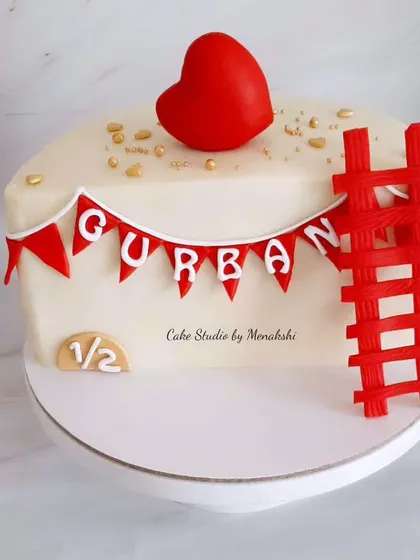 A sweet half birthday cake to celebrate a baby's six-month milestone. The simple design features a red heart and a little ladder.
