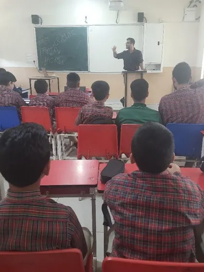 A classroom view from the back during our cybersecurity workshop at DAV Public School, with students listening to the instructor.