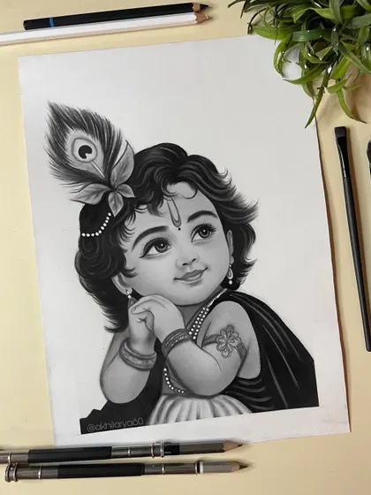 A gentle and innocent portrait of Bal Krishna, rendered in charcoal. This sketch captures a quiet, contemplative mood, with a focus on his expressive eyes and the single peacock feather.
