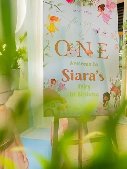 A "Welcome to the Fairy" sign, beautifully designed to set a magical tone right from the entrance.