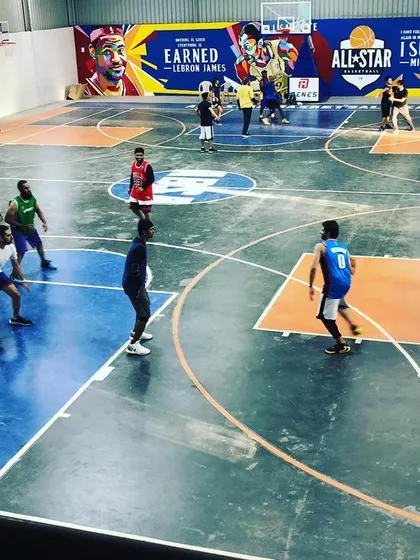 Players spread out during a fast-paced game. The clear markings for the key and three-point line make our court ideal for structured basketball play.