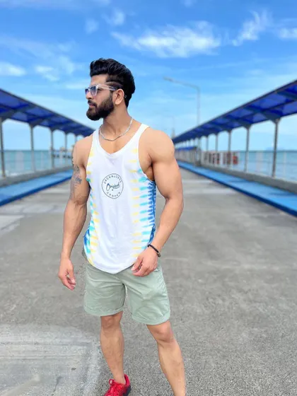 A lean body for a life of exploration. This shot from a pier shows how maintaining a clean diet and consistent workout routine pays off.