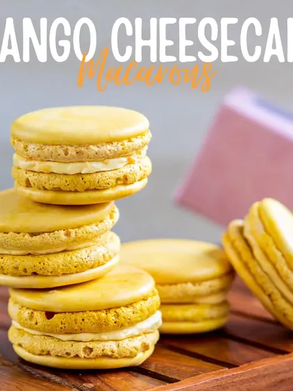 Bite-sized bliss. Our Mango Cheesecake Macarons have a crisp shell and a creamy mango cheesecake filling, capturing the essence of two of our favorite desserts in one bite.