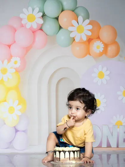 A thoughtful moment amidst the cake chaos. This baby is contemplating his next move.