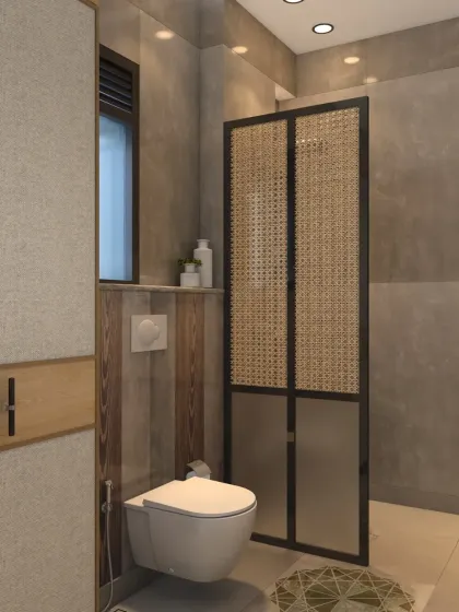 The shower area is separated by a fluted glass partition with an antique gold finish, adding a touch of luxury.