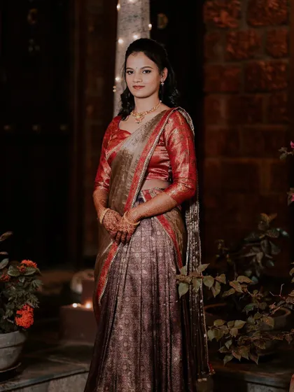 Dhanya's second look for her engagement, a beautiful half-saree. I can create multiple looks for the same event.