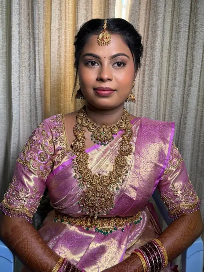 A portrait of Namratha, looking confident and beautiful. The makeup enhances her features without being overpowering.