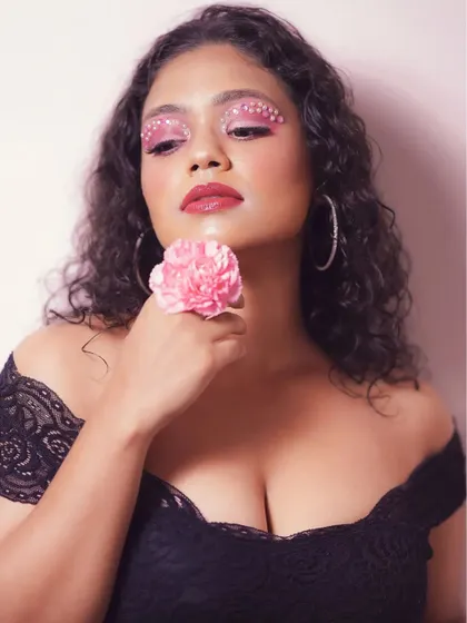 A slightly different angle of the pearl makeup look, showing how it catches the light. The combination of a bold lip and creative eyes makes for a memorable image.