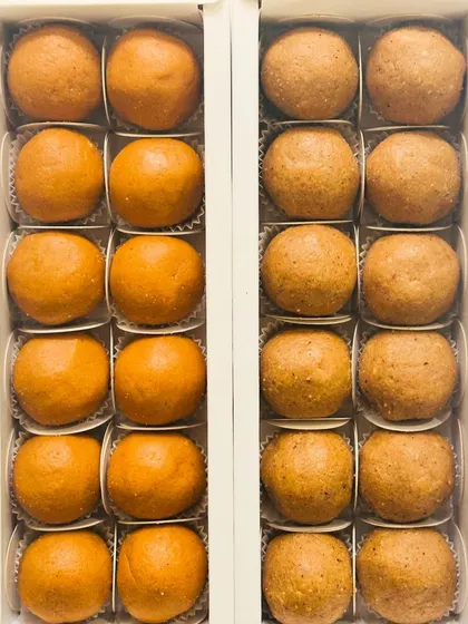 A side-by-side comparison of our Besan Laddoos and Atta Panjiri Laddoos. Both are made with desi ghee and are a staple for festive celebrations and gifting.