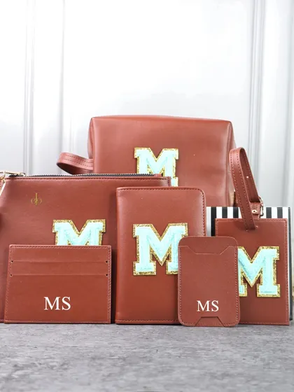 Pack your bags with style and elegance. My Monogram Travel Combo, shown here in a rich brown with a mint green initial, is the ultimate travel companion.