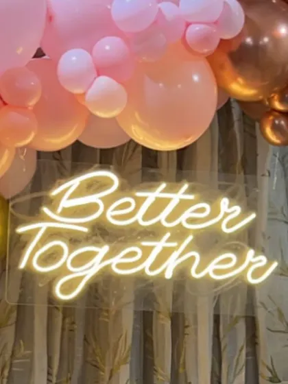 A close-up of the custom neon sign, which can be personalized with any message or name for your event.