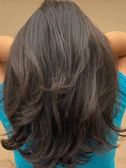The back of a client's hair, showing the beautiful, long layers and the volume they create.