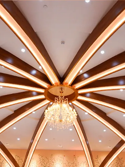 A closer look at the magnificent chandelier that hangs from our uniquely designed ceiling, adding a touch of splendor to every celebration.