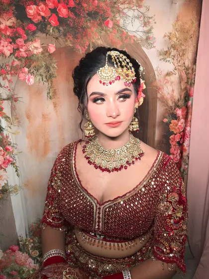 Another angle against the floral backdrop, showing how the makeup complements the setting.