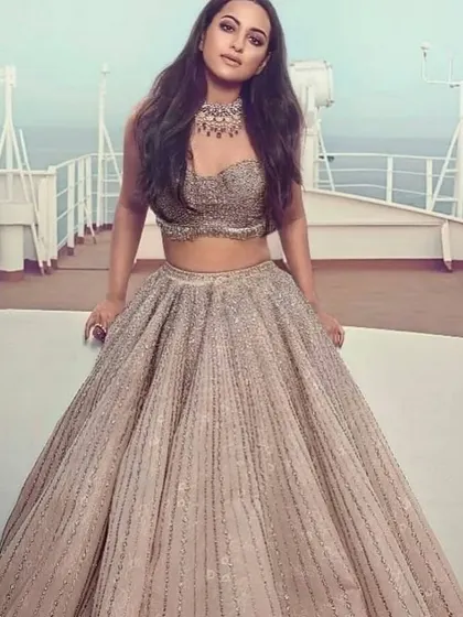 Sonakshi Sinha's pleated, embellished lehenga is a modern classic. I can create a similar style for you, focusing on texture and a flattering silhouette.