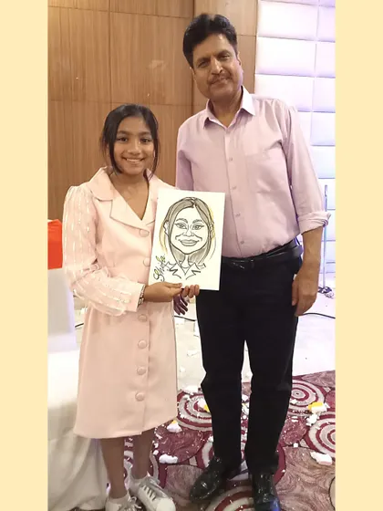 Standing with a happy client and her caricature. It’s a great photo opportunity for guests and a memory they can share.