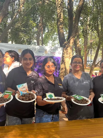 A group of students from Ramaiah University proudly displaying the seed balls they made. It's a great team effort for a positive environmental impact.