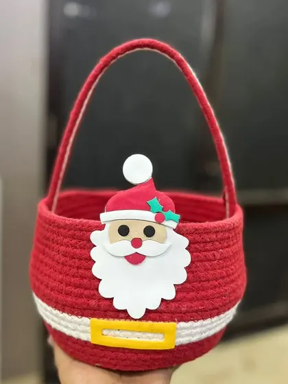 Get into the holiday spirit with this cute Santa-themed rope basket. It's perfect for creating your own Christmas hamper or as a festive home decoration.