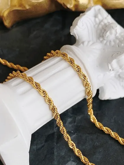 A close-up shot of the thick, twisted rope chain, showcasing its high-quality construction and brilliant gold-toned finish. This chain is designed to last.