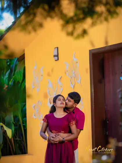 A sweet pre-wedding embrace against a vibrant yellow wall. I look for unique and colorful backdrops to make your photos pop.