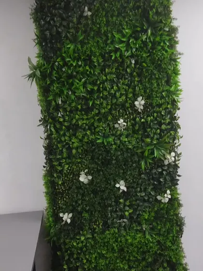 Another angle of the green wall panel with white flowers. These panels can be made in any size to fit specific pillars, columns, or wall sections in your space.