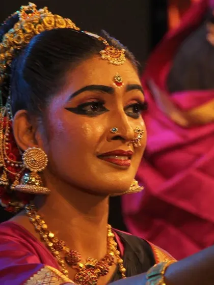 A close-up of a dancer's expressive face during the 'Ayyappa Kavuthuvam' performance, capturing the devotion and emotion conveyed through abhinaya.