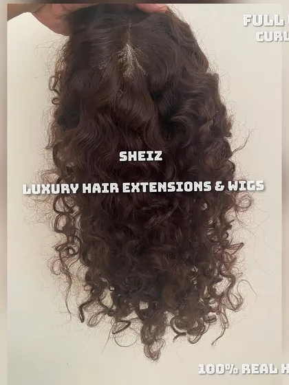 A beautiful, curly full wig made from 100% real hair. We can match any texture, from straight to wavy to curly.